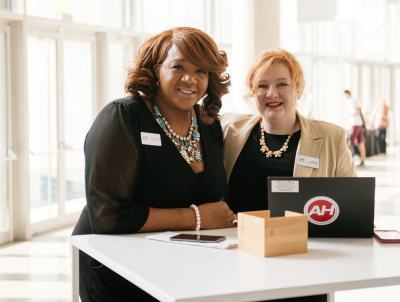 Association Management Company employees at a table