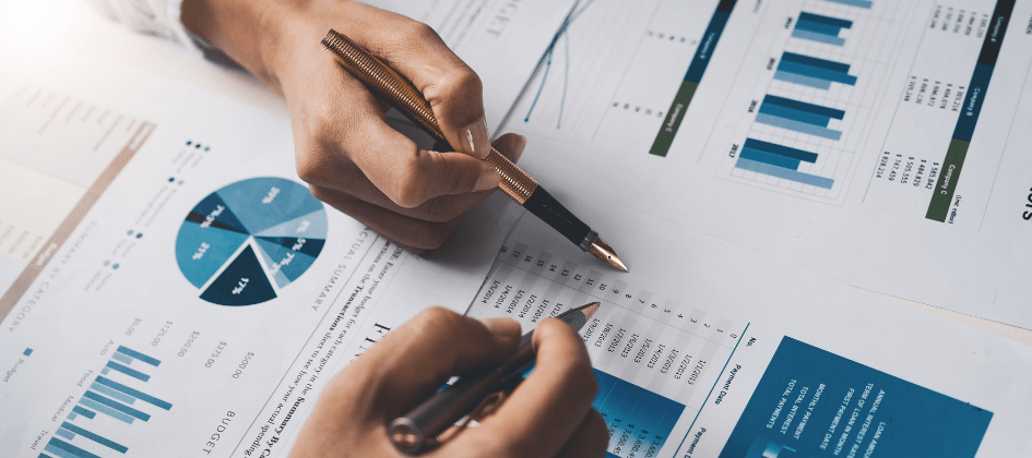 People reviewing a cost of doing business report